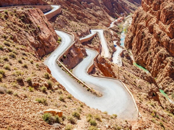 a winding road in a rocky mountain