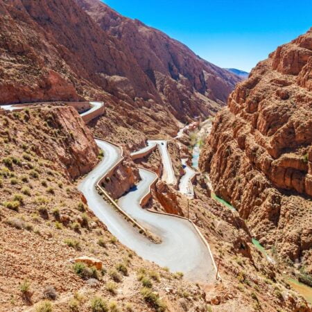 a winding road in a rocky canyon