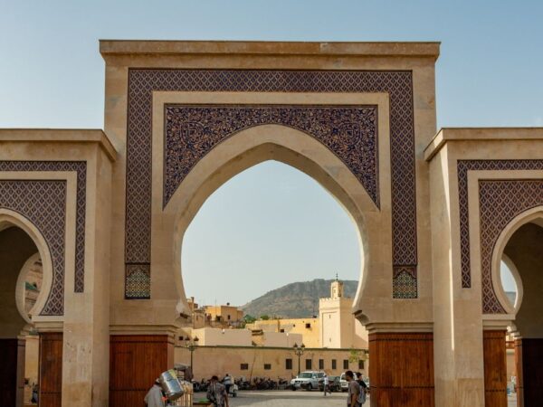 a large archway with a cart in front of a building