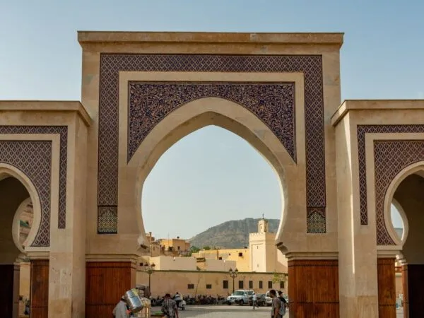 a large archway with a cart in front of a building