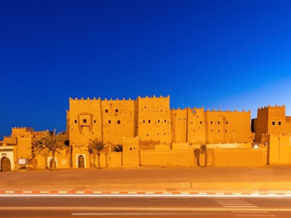 a large building with a street in the background