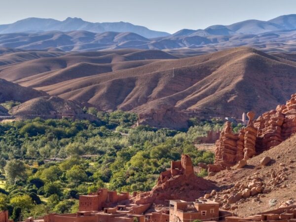 a landscape with a village and mountains