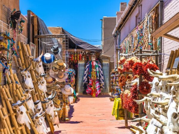 a street with a store full of skulls and other objects