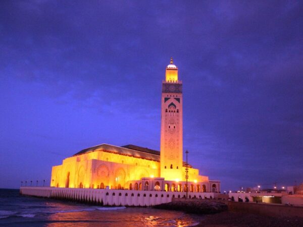 a building with a tower on a dock