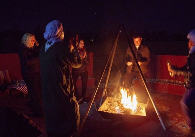 a group of people around a fire