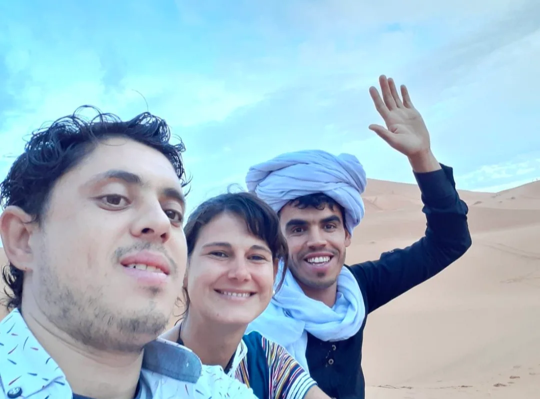 Youssef Ouazza with guests during a Morocco Desert Tour in Merzouga