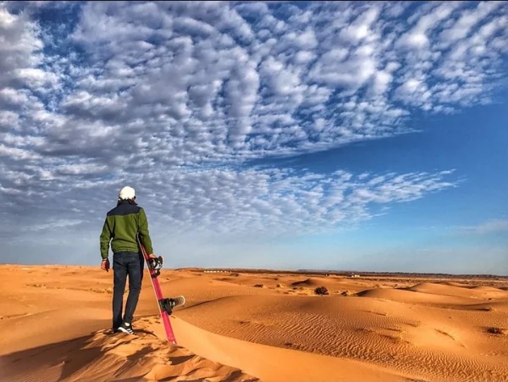guest explore sand boarding experience in merzouga